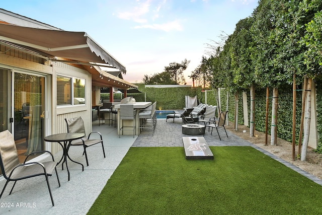 view of patio featuring a fire pit and fence