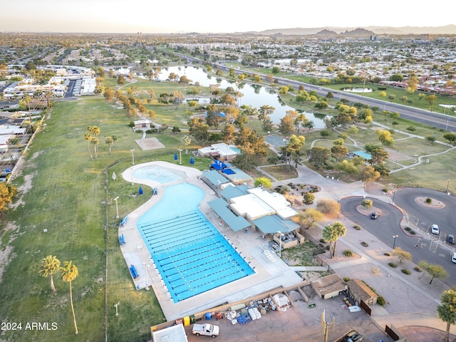 birds eye view of property with a water view