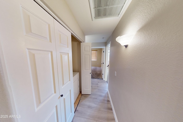 corridor featuring light hardwood / wood-style flooring