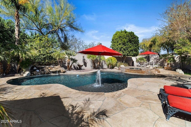 view of pool featuring a fenced in pool, a patio area, a fenced backyard, and an in ground hot tub