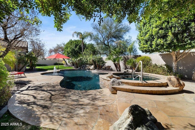 view of swimming pool with a patio area, a fenced backyard, and an in ground hot tub