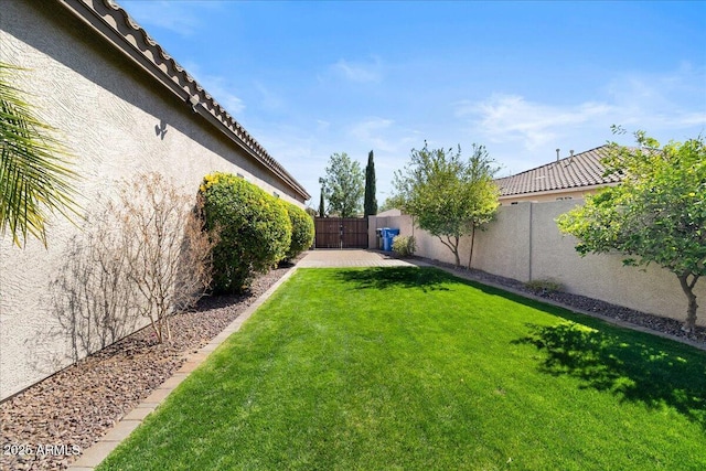 view of yard with a fenced backyard