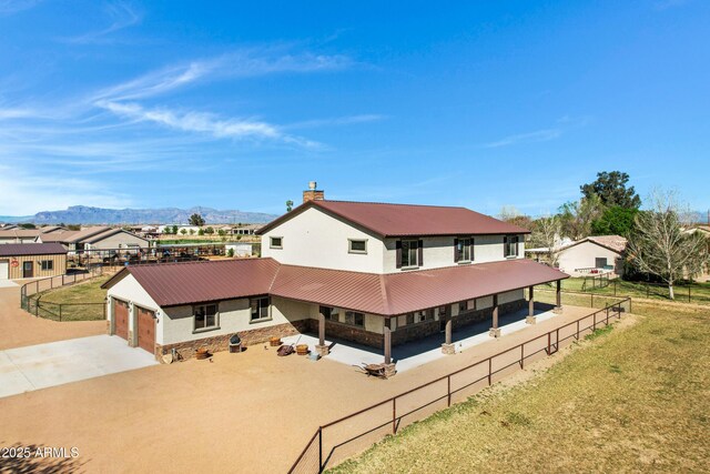 birds eye view of property with a mountain view