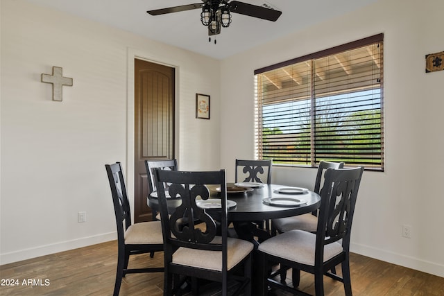 dining space featuring ceiling fan and dark hardwood / wood-style floors