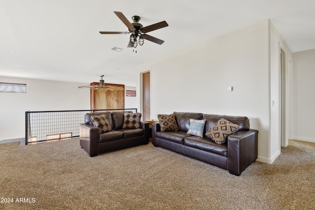 carpeted living room with ceiling fan