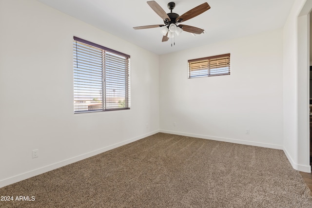 unfurnished room with ceiling fan and carpet floors