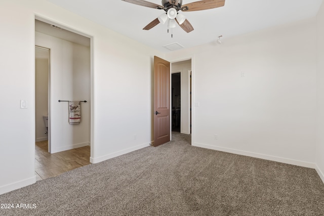 unfurnished bedroom with light colored carpet and ceiling fan