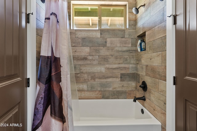 bathroom with shower / bathtub combination with curtain