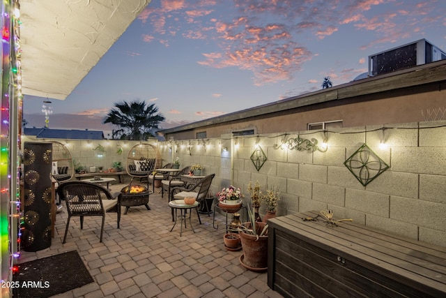 patio terrace at dusk with a fire pit