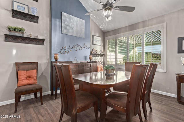 dining room featuring ceiling fan, dark wood-type flooring, and vaulted ceiling