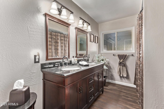 bathroom with vanity and wood-type flooring