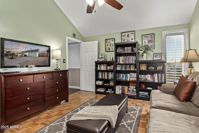 living room featuring ceiling fan, vaulted ceiling, and light parquet floors