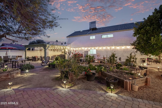 view of patio terrace at dusk