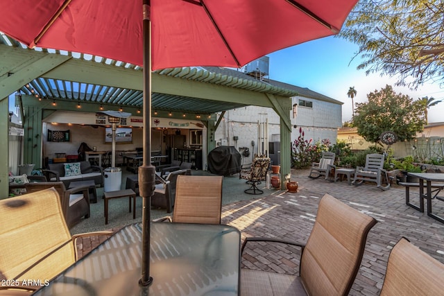 view of patio / terrace with a pergola and a grill