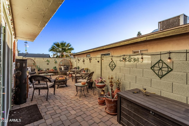 view of patio / terrace with an outdoor fire pit