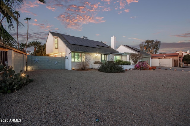 view of front of house with solar panels