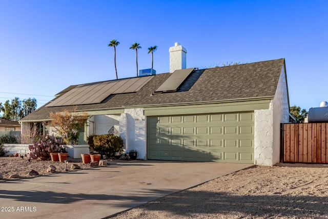 single story home featuring solar panels