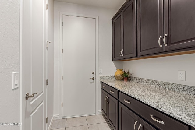 laundry room with light tile patterned floors