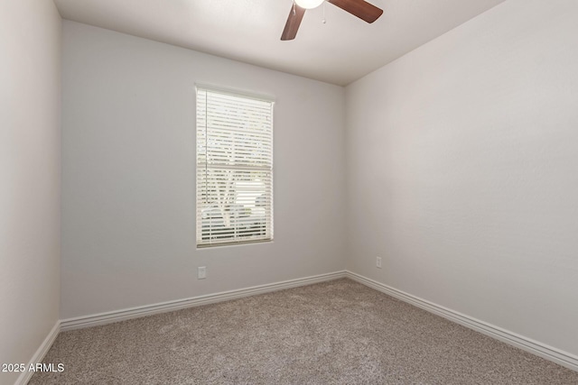 empty room featuring carpet floors and ceiling fan