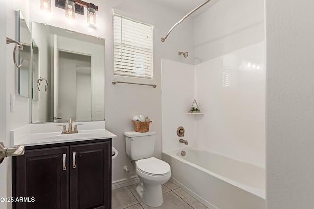 full bathroom with bathtub / shower combination, toilet, vanity, and tile patterned flooring