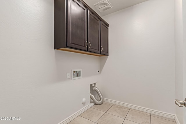 laundry room with cabinets, hookup for a gas dryer, hookup for a washing machine, and hookup for an electric dryer