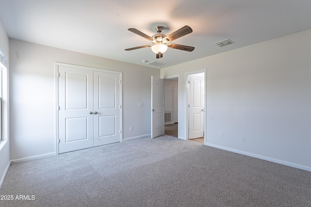 359 E Watson Pl, Casa Grande, AZ 85122 - unfurnished bedroom featuring carpet flooring, baseboards, a closet, and a ceiling fan