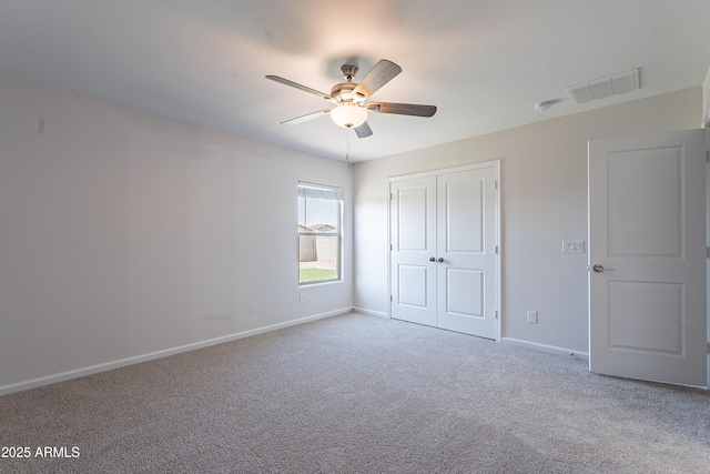 359 E Watson Pl, Casa Grande, AZ 85122 - unfurnished bedroom featuring carpet floors, baseboards, a closet, and a ceiling fan