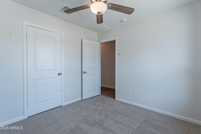 359 E Watson Pl, Casa Grande, AZ 85122 - unfurnished bedroom featuring carpet floors, baseboards, and a ceiling fan