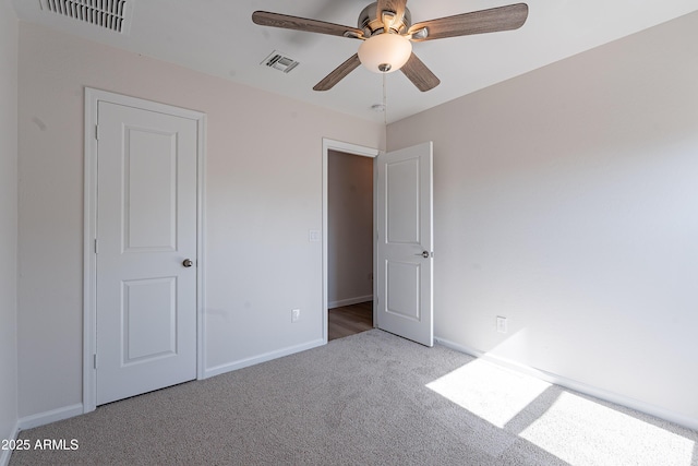 359 E Watson Pl, Casa Grande, AZ 85122 - unfurnished bedroom featuring carpet floors, baseboards, and ceiling fan