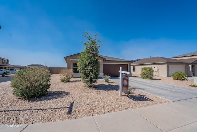 359 E Watson Pl, Casa Grande, AZ 85122 - view of front facade with concrete driveway, an attached garage, and stucco siding