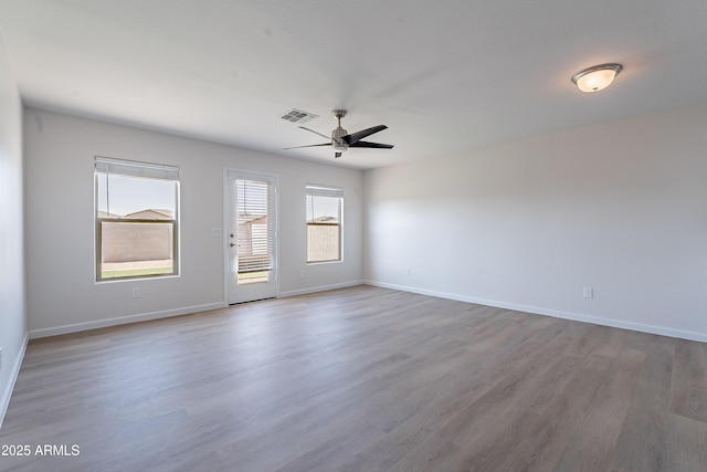 359 E Watson Pl, Casa Grande, AZ 85122 - spare room with ceiling fan, wood finished floors, and baseboards