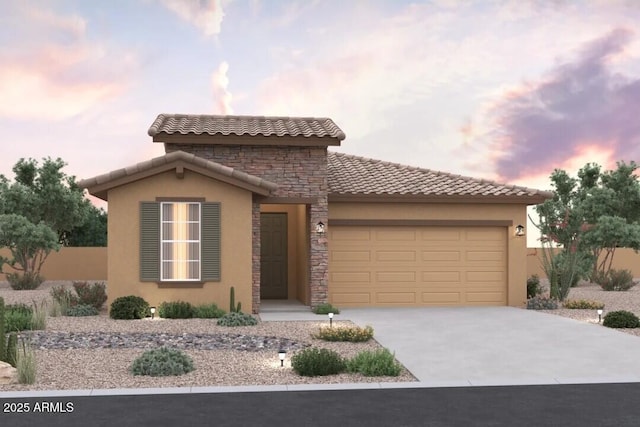 mediterranean / spanish-style home featuring a garage, stucco siding, concrete driveway, and a tile roof