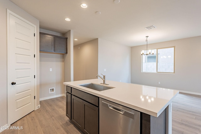 kitchen with visible vents, recessed lighting, dishwasher, a sink, and light wood finished floors
