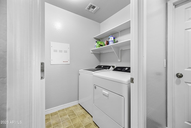 laundry room featuring washer and dryer, baseboards, laundry area, and visible vents