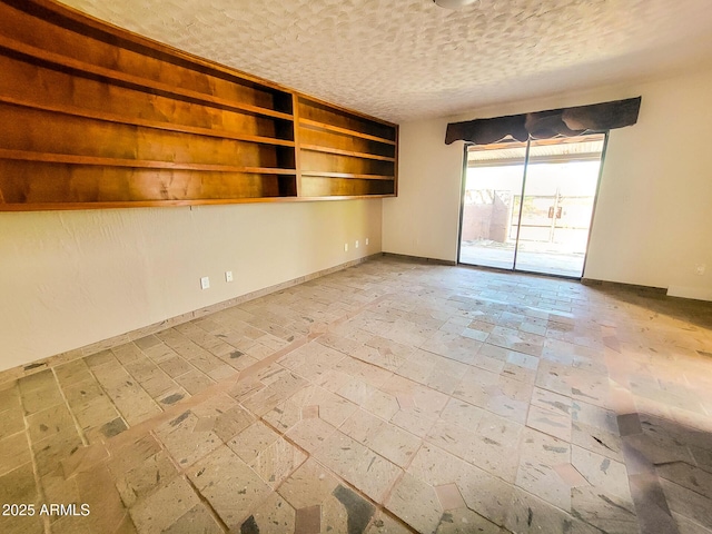 empty room with a textured ceiling