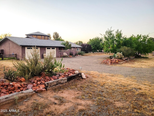 view of yard at dusk