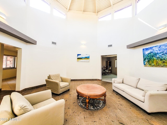 living room with a towering ceiling