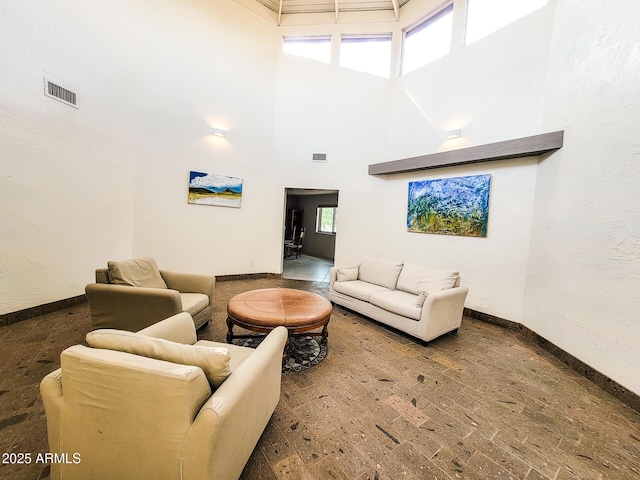 living room featuring a high ceiling