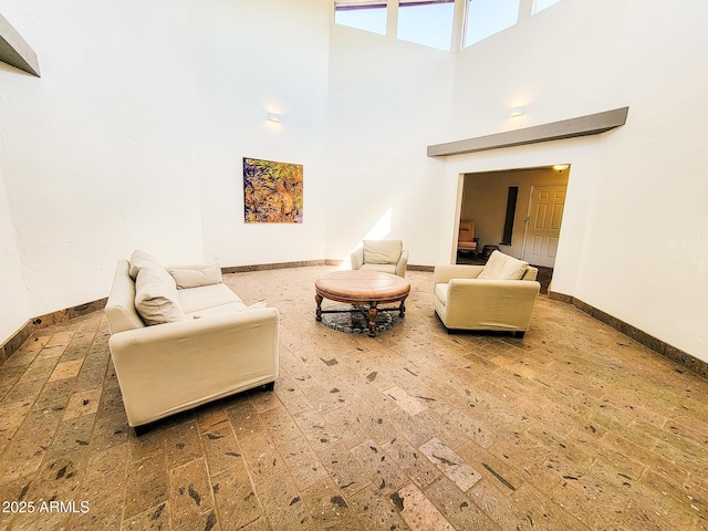 living room with a towering ceiling