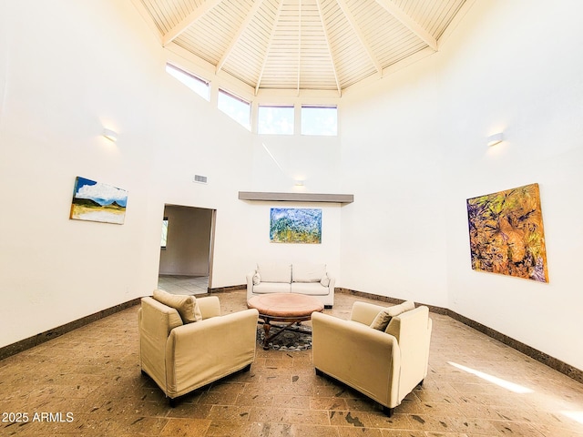 living room with a towering ceiling