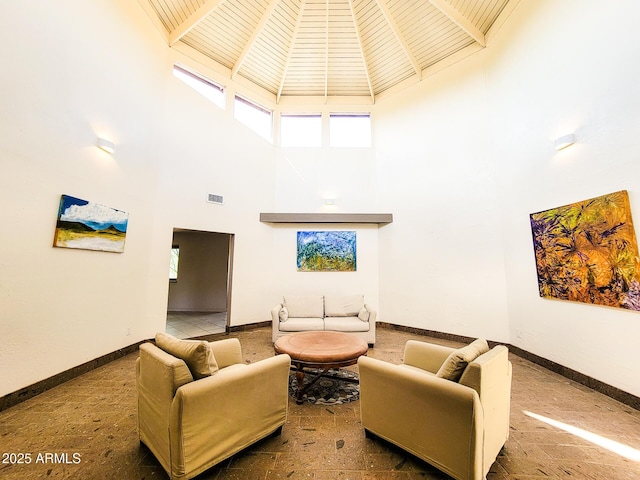 living room with a towering ceiling