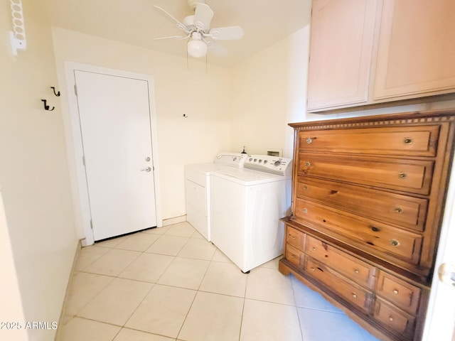 laundry room featuring ceiling fan, washer and clothes dryer, light tile patterned floors, and cabinets