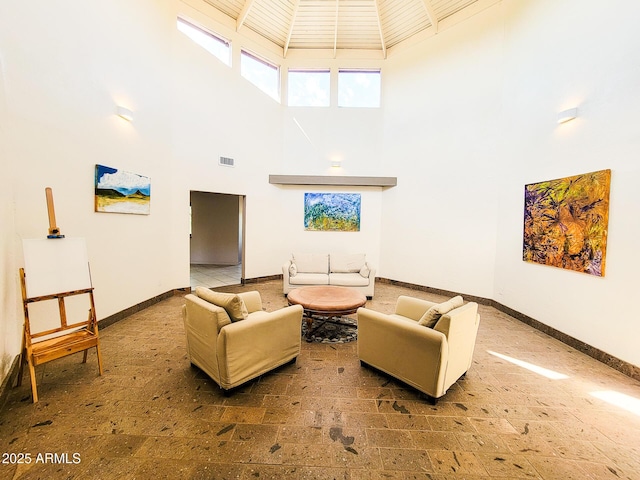 living room featuring a high ceiling