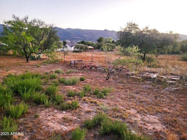 mountain view featuring a rural view