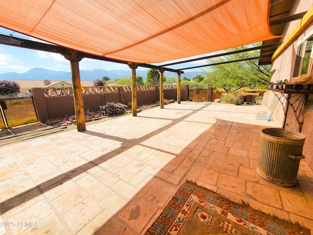 view of patio / terrace featuring a mountain view