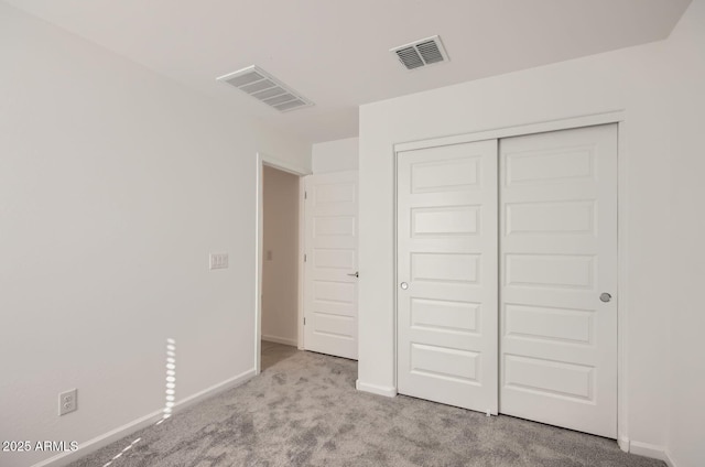 12086 E Sunflower Ln, Florence, AZ 85132 - unfurnished bedroom featuring baseboards, carpet flooring, and visible vents
