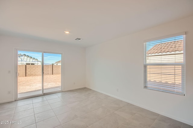 12086 E Sunflower Ln, Florence, AZ 85132 - unfurnished room featuring light tile patterned floors, baseboards, and visible vents