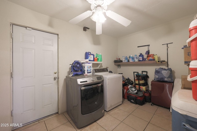 laundry area featuring washer and dryer, ceiling fan, and light tile patterned floors