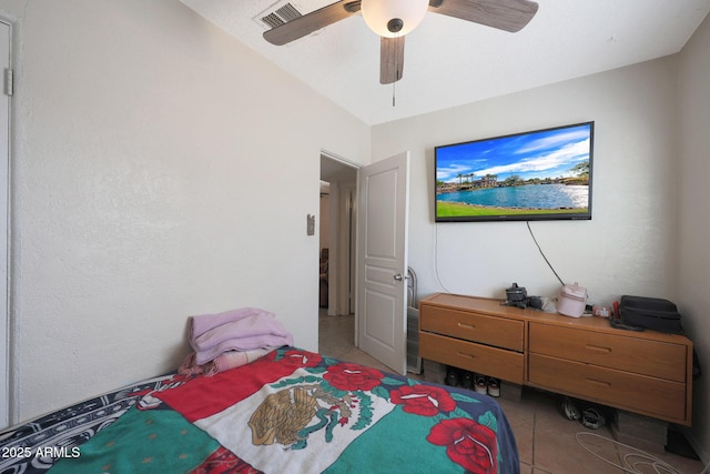 bedroom with light tile patterned floors and ceiling fan