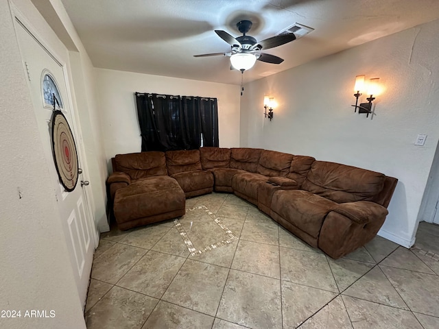 tiled living room with ceiling fan